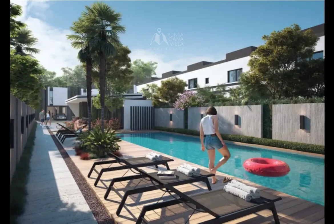 Resort-style community swimming pool surrounded by palm trees