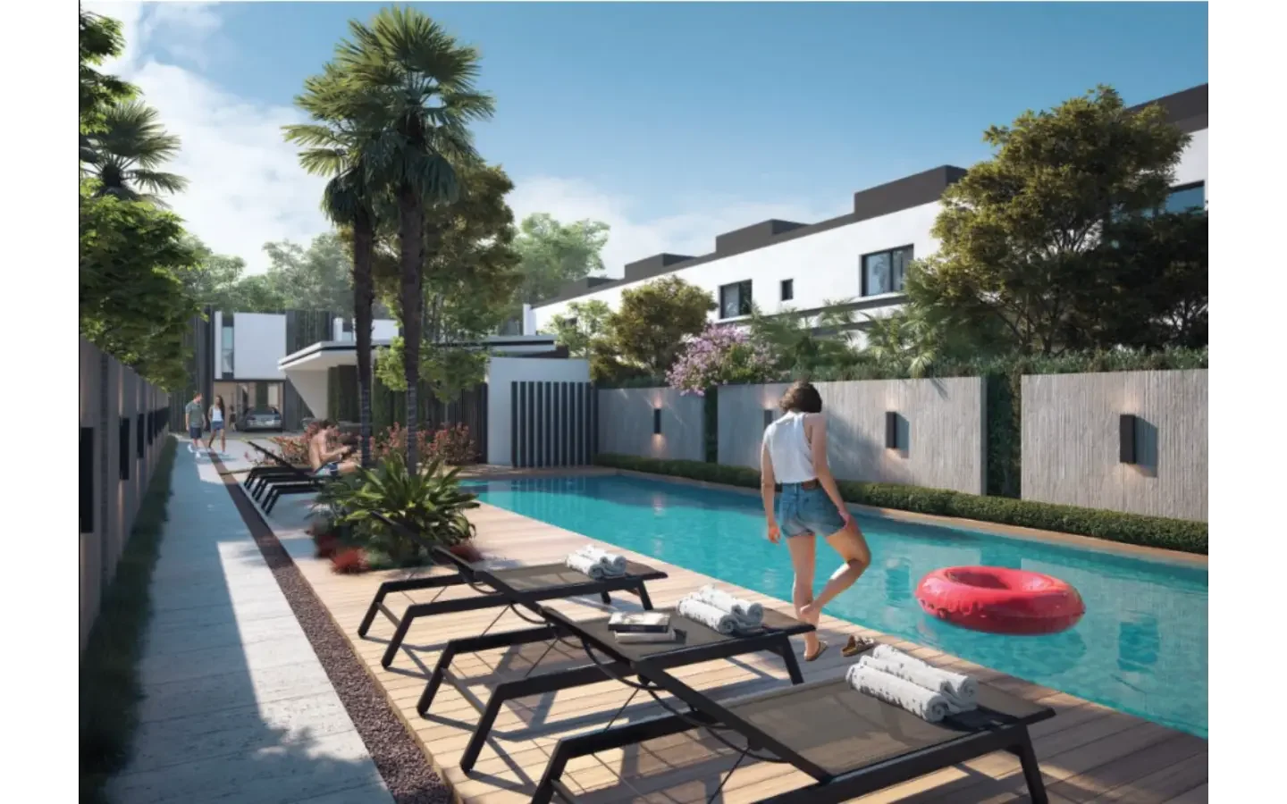 Resort-style community swimming pool surrounded by palm trees